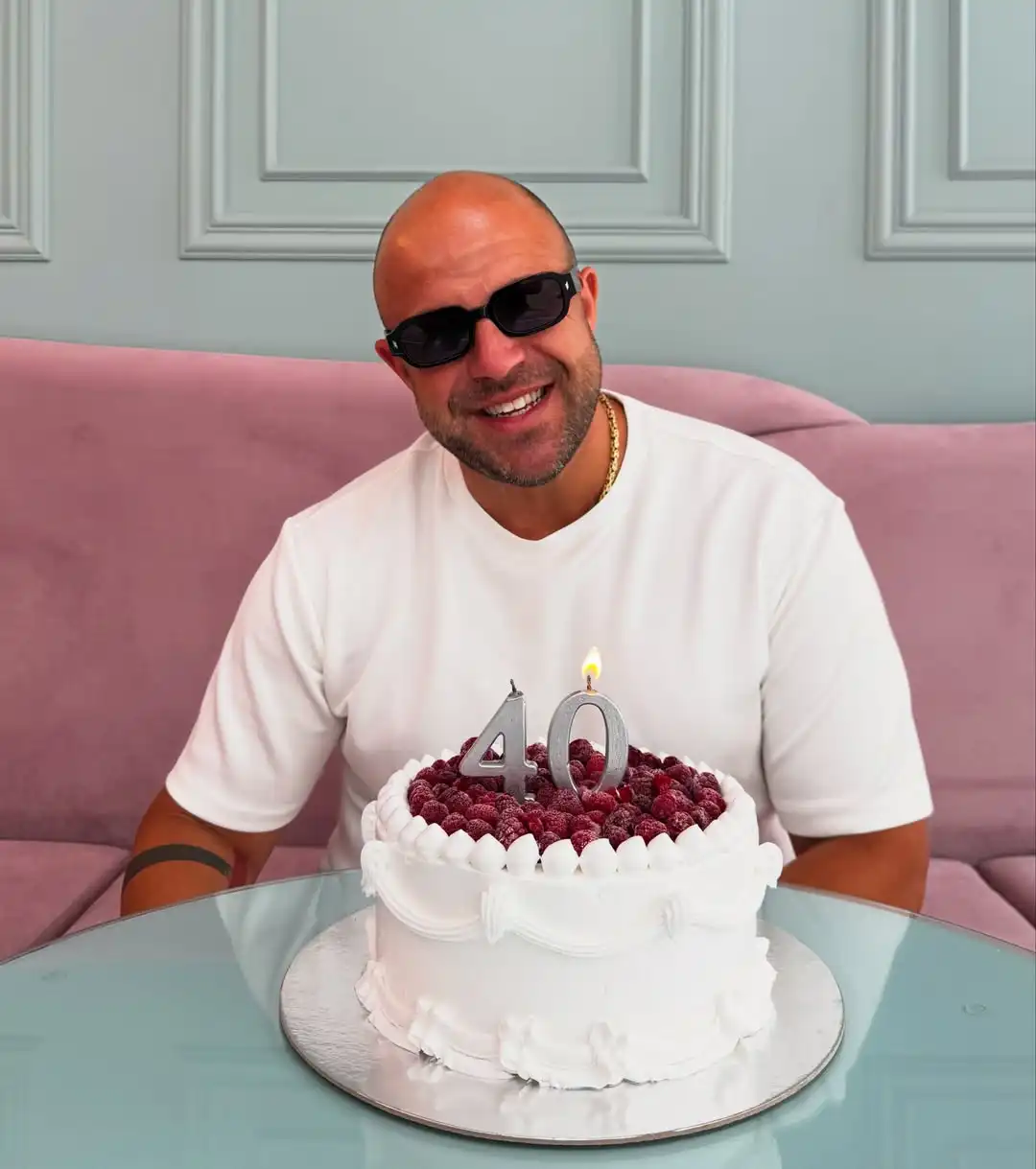 A Heavy White Tee With Black Shades and a Gold Chain