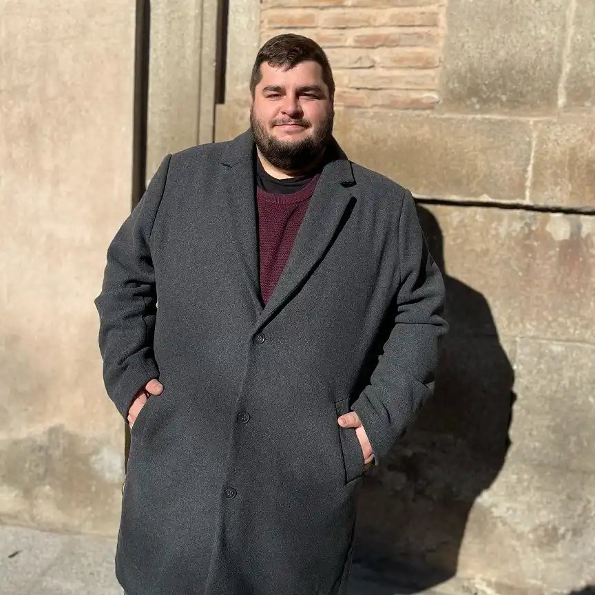 18 Winter Office Outfits for a Bigger Frame 6 Charcoal Overcoat Over a Burgundy Sweater for the Winter Commute