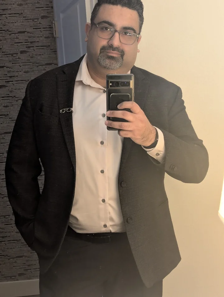 18 Winter Office Outfits for a Bigger Frame 18 Textured Dark Blazer With a Soft Pink Shirt and No Tie