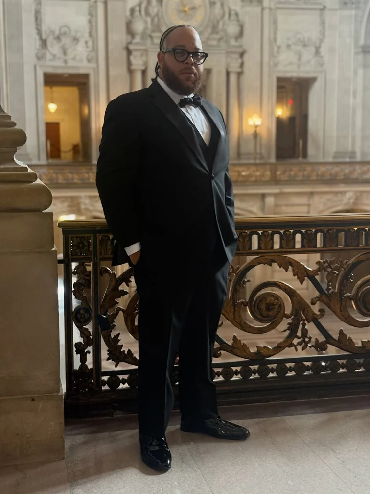Black Tuxedo With a Matching Vest for One Unbroken Column